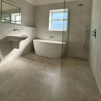 bath and shower in wetroom